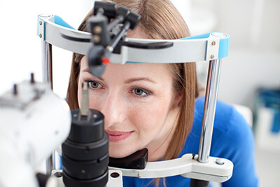 Woman having an eye exam performed